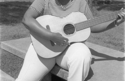 Barbara Jordan playing a guitar