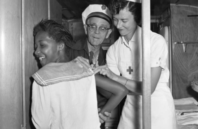 A nurse administering the polio vaccine