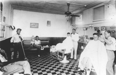 A barbershop scene in the Houston Heights